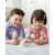 Two children playing with SKIP HOP Zoo Sweet Scoops Ice Cream Stacking Set with Color Changing Scoops, Unicorn, and Rainbow Stand