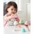 Child playing with SKIP HOP Zoo Sweet Scoops Ice Cream Stacking Set with Color Changing Scoops, Unicorn, and Rainbow Stand
