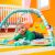 Baby lying on Bright Starts Wild Wiggles Activity Gym play mat