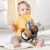 Infant chewing on SKIP HOP Bandana Buddies Monkey Teether Toy