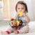 Baby playing with SKIP HOP Bandana Buddies Monkey Teether Toy
