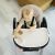 Baby using Petite&Mars Tasty High Chair in Mature Olive color