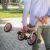 Man carrying PETITE&MARS 5in1 Turbo Tricycle