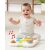 Baby playing with SKIP HOP Explore & More activity panel, sit-and-play mode