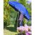 Pepita 2m blue tilting beach umbrella with UV protection, showing a person holding the umbrella in a garden setting