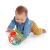 Baby playing with OBall Rollin Rainstick rattle while crawling