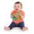 Happy baby holding OBall Rollin Rainstick rattle toy