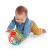 Baby playing with OBall Rollin Rainstick rattle while crawling