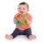 Happy baby holding OBall Rollin Rainstick rattle toy