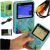 G5 Retro Mini Portable Game Console with accessories, packaging and in hand