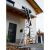 KRAUSE CORDA 3x9 multi-purpose ladder in use, reaching a house
