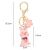 Mágikus kulcstartó malacka és virág címkével, szélessége 3 cm, magassága 5,5 cm, teljes hossza karabinerrel 12,5 cm 123876909