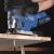 Scheppach BC-JS254-X cordless jigsaw cutting plywood close-up