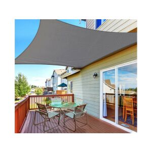 Szürke árnyékvitorla telepítve egy teraszra asztallal és székekkel, árnyékot biztosítva a naptól - Verk Group