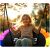 Happy girl swinging on Neo-Sport Swingo nest swing
