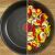 Tefal Eco Resist frying pan, half empty, half with cooked vegetables