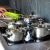 BRAVA cookware set on induction hob in modern kitchen