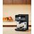 Krups XP384G10 Authentic+ espresso machine brewing coffee in kitchen setting
