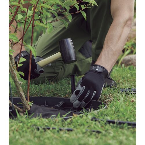 Installing Borderkit Flexi garden edging around a plant