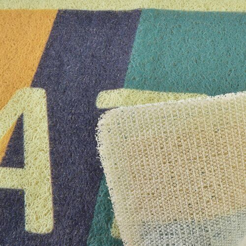 Közelkép a ZAC fürdőszobai szőnyegről, amely a csúszásmentes hátlapot és a szőtt textúrát mutatja