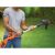 Black & Decker ST182320-QW cordless grass trimmer held by a person
