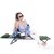 Springos green folding sun lounger, woman relaxing in sun