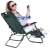 Woman relaxing in a green Springos folding lounge chair with a phone and headphones