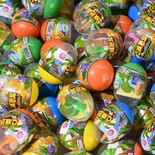 Dinoszaurusz meglepetés tojás, színes műanyag tojások, mindegyikben egy dinoszaurusz játékkal, tökéletes húsvéti kosárba vagy parti ajándéknak