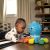 Baby Einstein Go Opus Go 4-in-1 crawling toy with baby playing