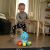 Toddler playing with Baby Einstein Go Opus Go interactive toy