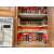 White spice rack organizer in a kitchen cabinet, before and after organization