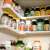 Organized supplements on kitchen cabinet organizer shelves