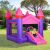 Children enjoying Pepita Castle inflatable bouncy house with slide