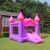Pepita Castle inflatable bouncy house with slide in garden