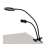<product_name> desk lamp with phone holder, black, mounted on a desk