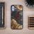 Bewood Planets Pluto tok iPhone 16 Plus - barna-szürke, valódi fa telefontok egyedi gyantával, iPhone 16 Plus-hoz, fa asztalon