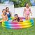 Intex rainbow inflatable pool with kids playing in the backyard
