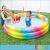 Intex rainbow inflatable pool with kids playing in the backyard