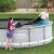 People installing Bestway pool cover on Power Steel pool
