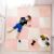 Child lying on Ricokids peach and white foam puzzle mat