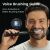 Man using Oclean X Ultra 20 electric toothbrush with voice brushing guide