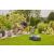 Gardena SILENO MAX 900m2 robotic lawnmower in use, mowing the lawn, man relaxing in the garden