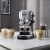 De'Longhi Dedica Arte EC950.M espresso machine in a kitchen setting with coffee drinks.