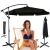 Black cantilever garden parasol with cover and woman relaxing