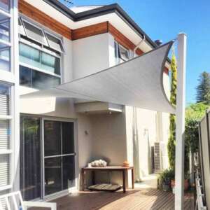 Gray triangular sun sail, 3.6x3.6x3.6m, providing shade for patio, garden, or playground - Shade Sail