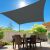 Springos dark grey rectangular shade sail providing shade over patio dining area