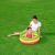 Child playing in Bestway Summer inflatable kiddie pool, 70x24cm on grass
