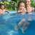 Happy family in Bestway Steel Pro pool, summer vacation