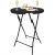 Springos black folding bar table with drinks and snacks