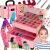 Children's makeup set in pink suitcase with girl using makeup